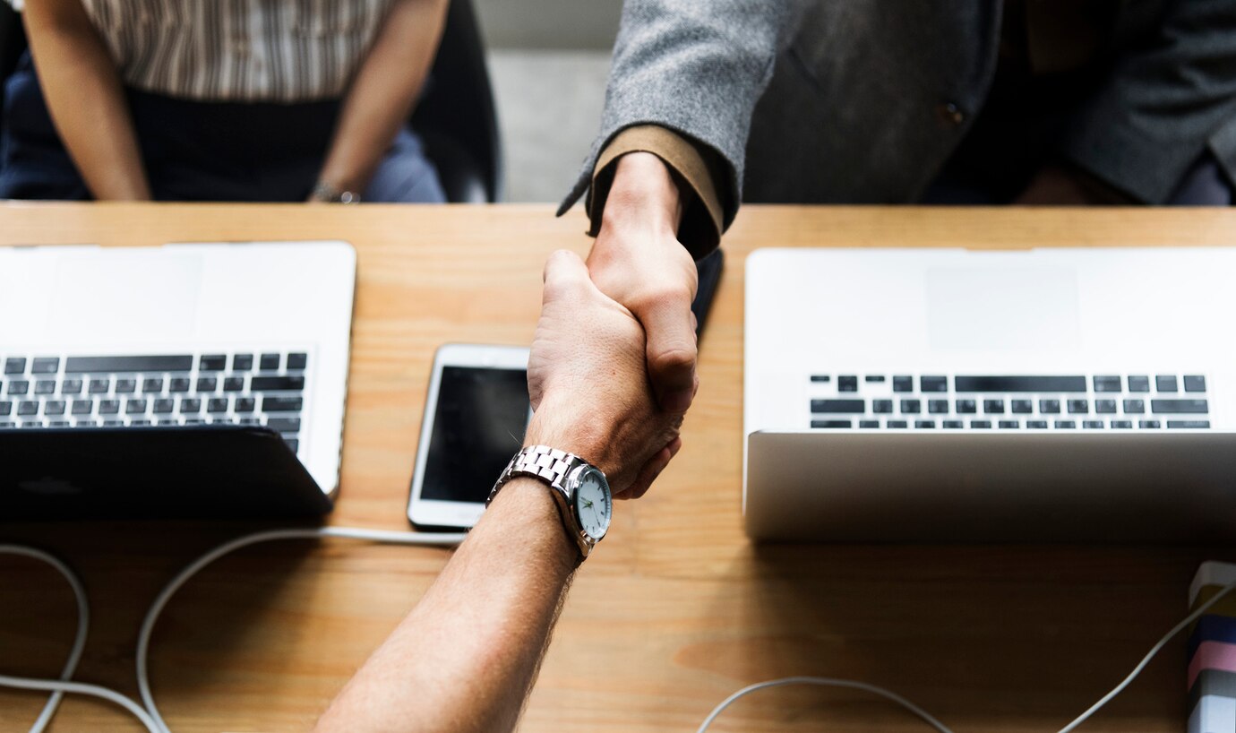 business-people-shaking-hands-agreement_53876-25066